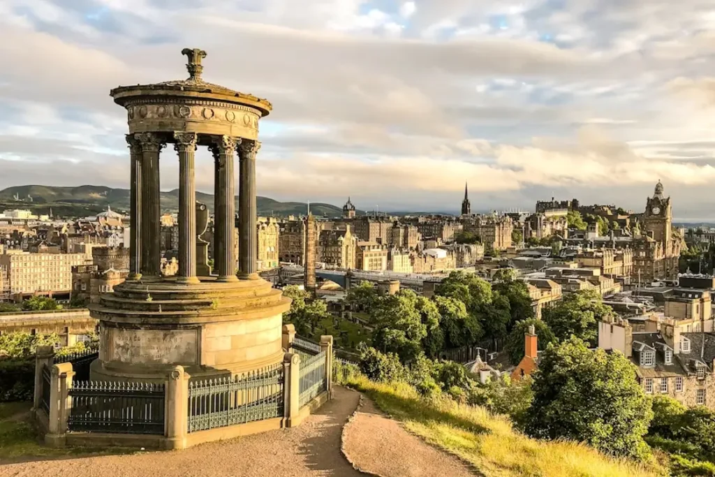 View over Edinburgh from Calton Hill with the Dugald Stewart Monument in the foreground.