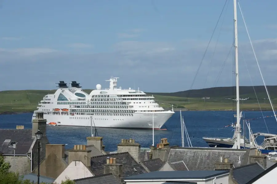 Scotland cruise guide image showing a cruise ship anchored near Lerwick, Shetland