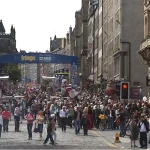 royal mile during edinburgh festival with crowds and busy streets in august