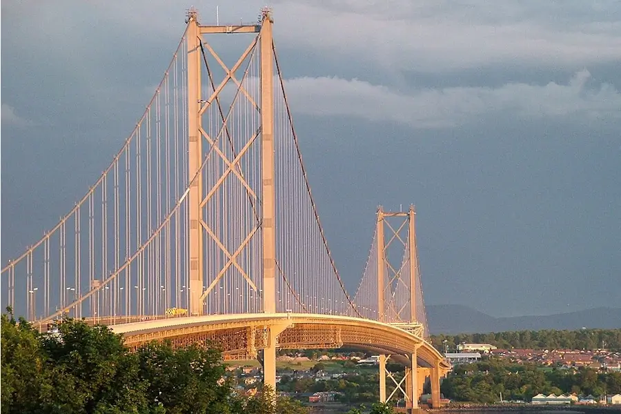 Forth Road Bridge at dusk from the north side showing south queensferry and the pentland hills in the background