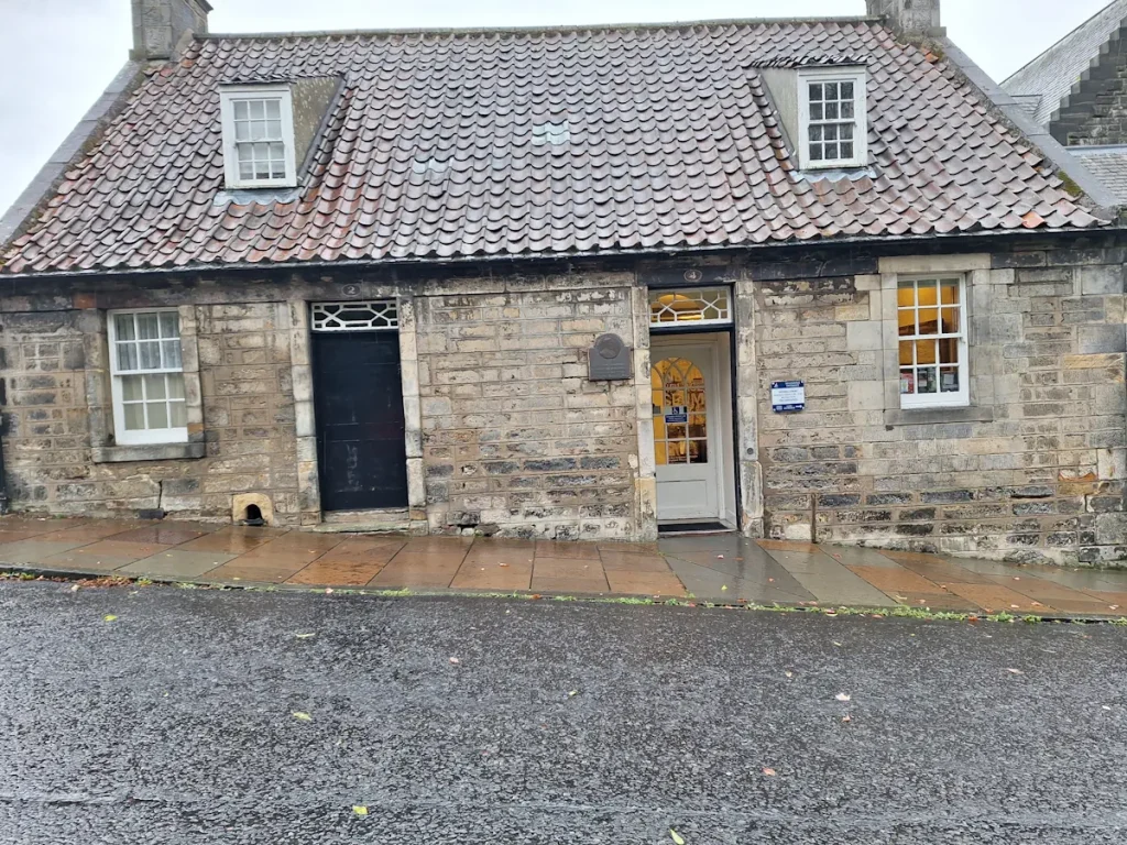Andrew Carnegie’s birthplace cottage in Dunfermline, a small stone house with a tiled roof